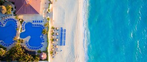 On the beach, sun loungers, beach umbrellas, beach towels