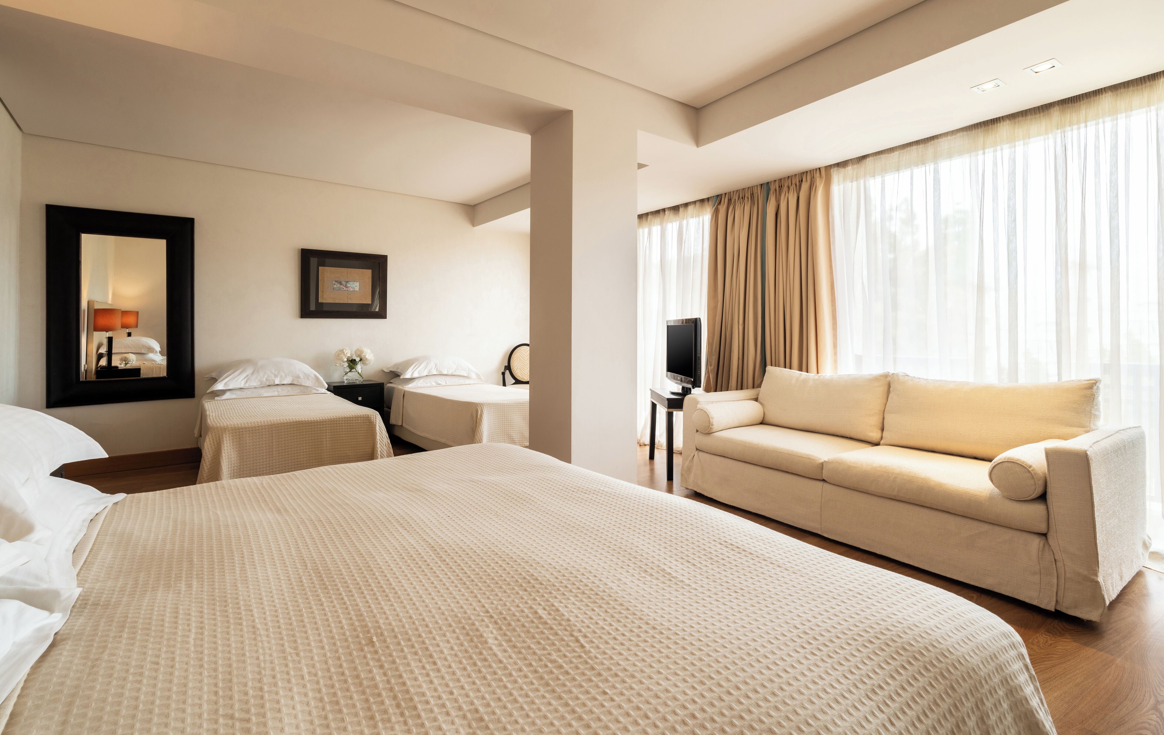 family room, city view | 1 bedroom, premium bedding, minibar, in-room safe