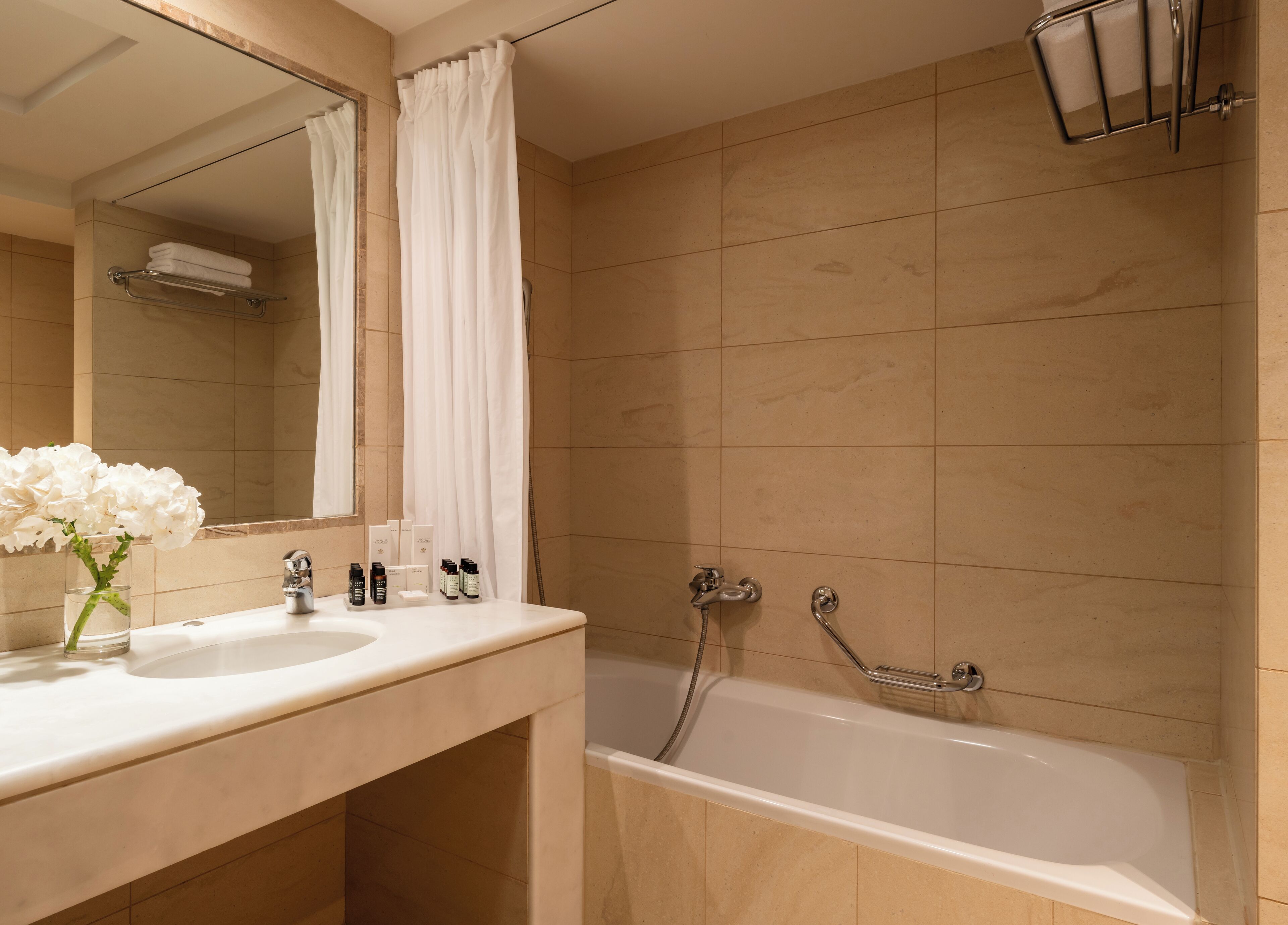 bathtub, bathrobes, slippers, towels