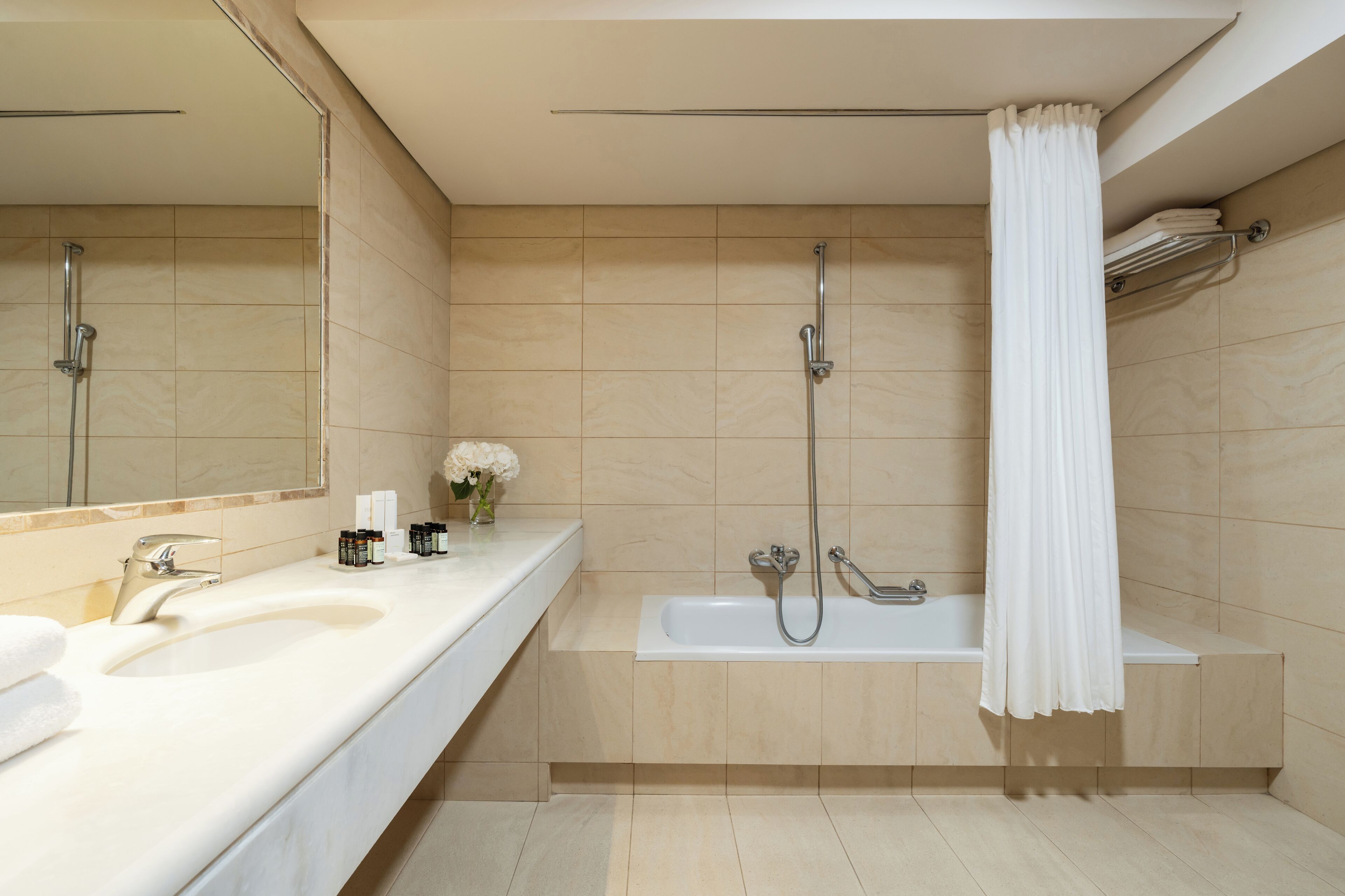 bathtub, bathrobes, slippers, towels