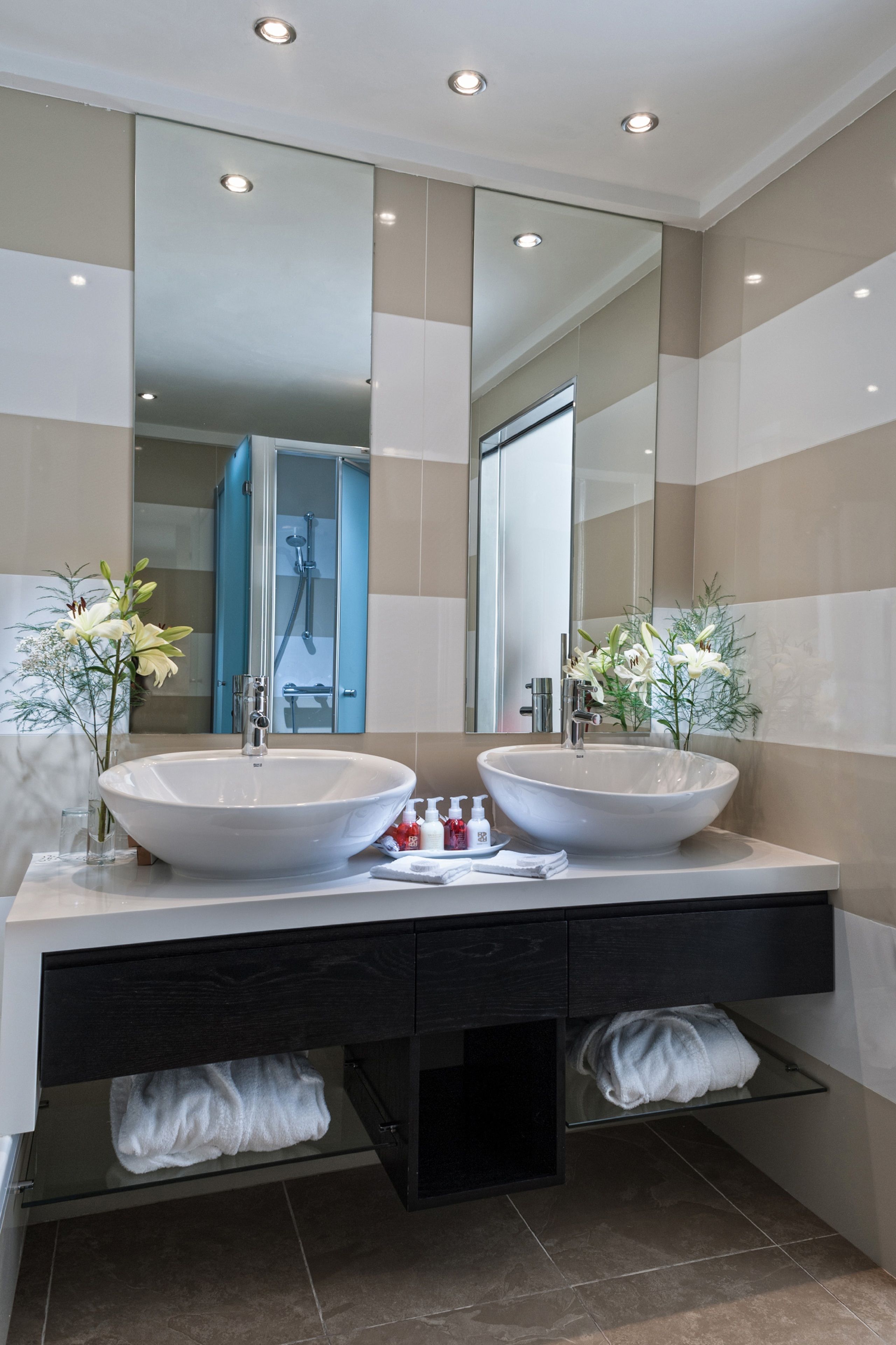 combined shower/bathtub, eco-friendly toiletries, hair dryer, bathrobes