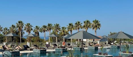 Indoor pool, outdoor pool, pool umbrellas, sun loungers