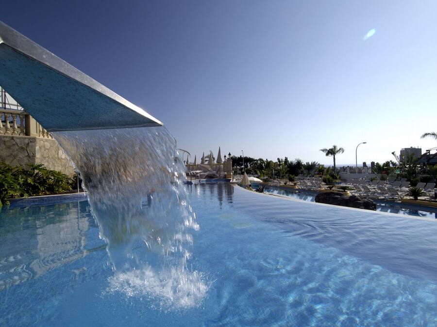 3 outdoor pools, open 9:00 AM to 7:00 PM, pool umbrellas, pool loungers