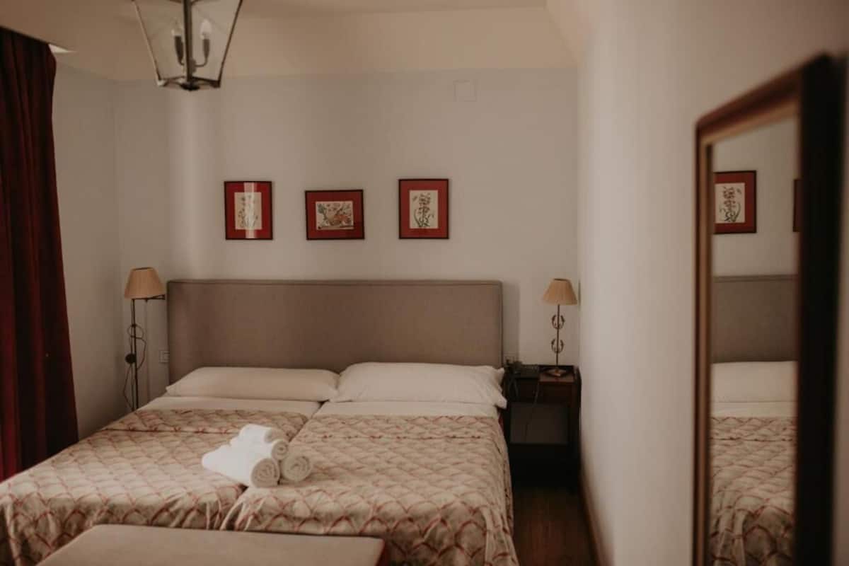 Hypo-allergenic bedding available, down comforters, desk