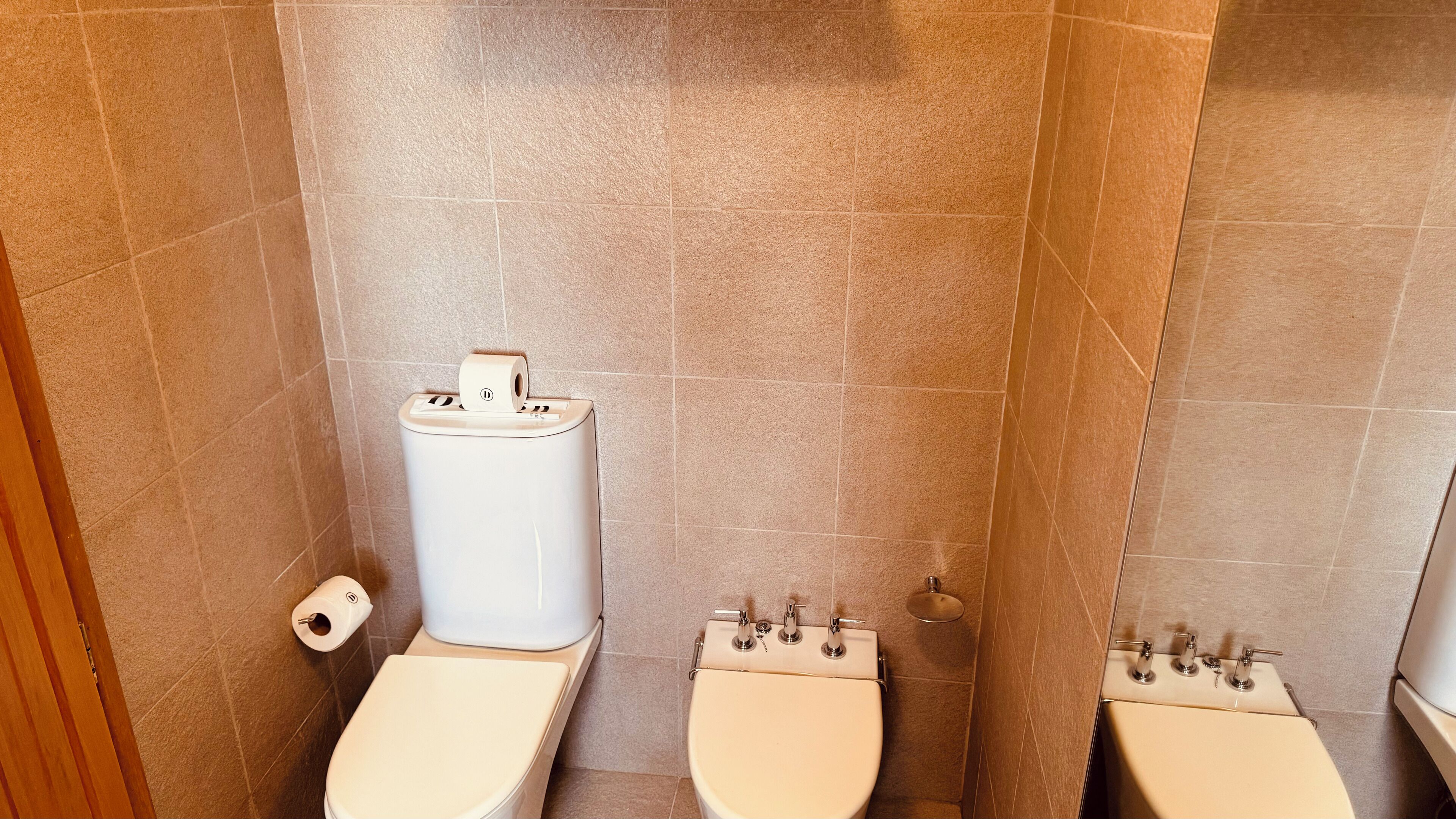 junior studio suite | bathroom | eco-friendly toiletries, hair dryer, bidet, towels