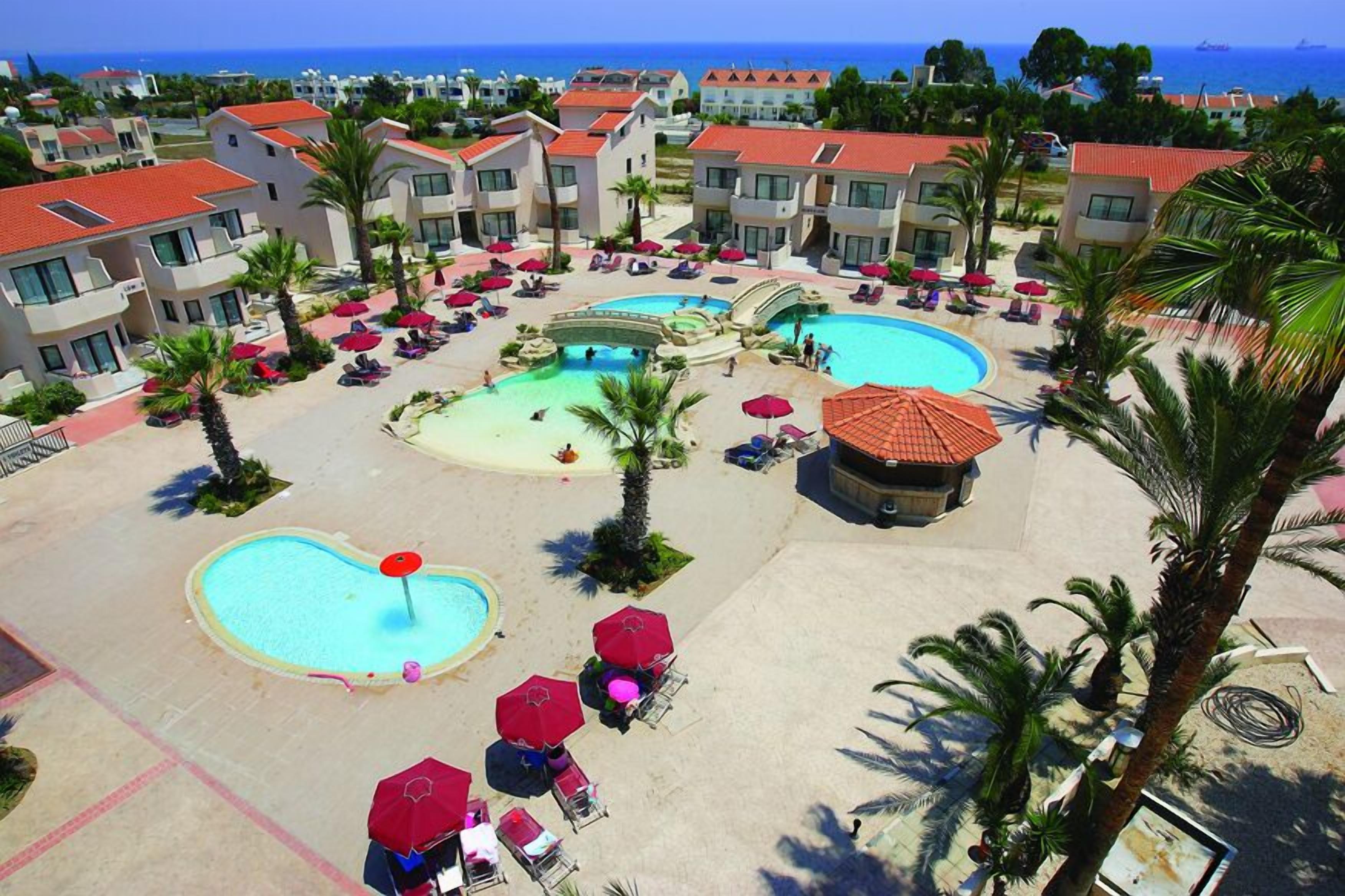 2 outdoor pools, open 6:30 AM to 7:00 PM, pool umbrellas, pool loungers