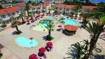 2 outdoor pools, open 6:30 AM to 7:00 PM, pool umbrellas, pool loungers