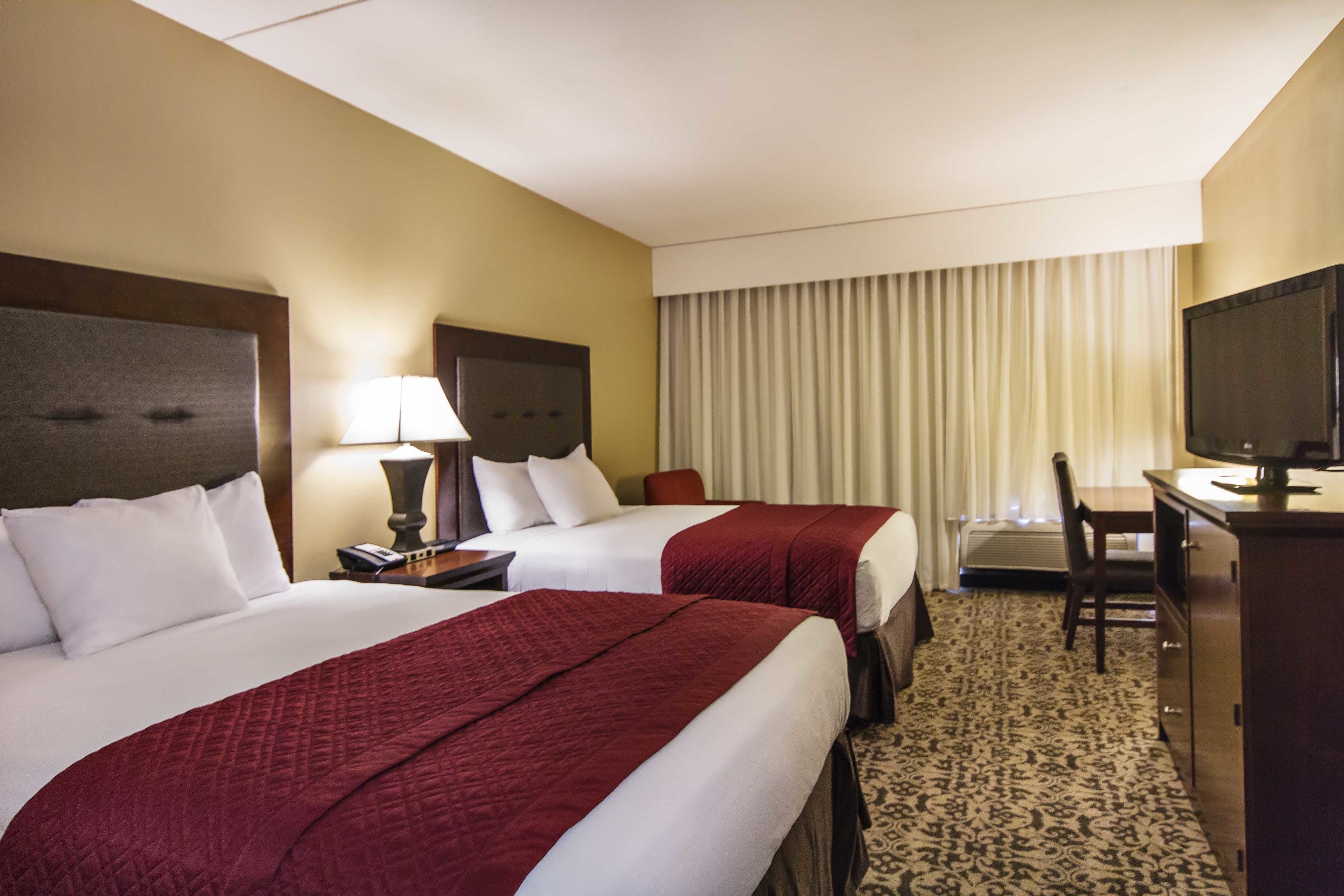 premium bedding, desk, blackout curtains, iron/ironing board