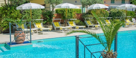 Seasonal outdoor pool, open 9:00 AM to 7:00 PM, pool umbrellas