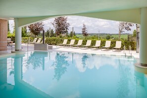 Indoor pool, seasonal outdoor pool, pool umbrellas, pool loungers