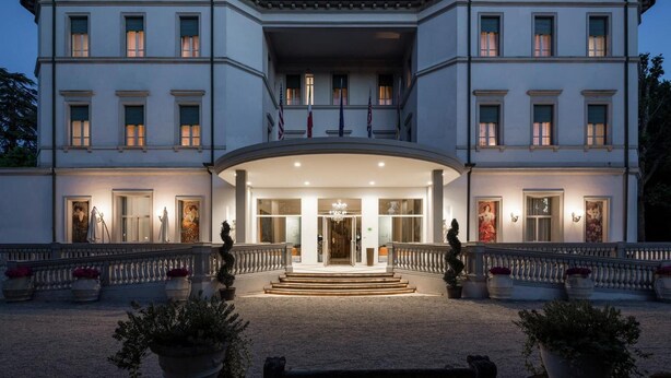 A grand, two-story building with a symmetrical facade, large windows, and a central entrance with steps leading up to it. - Grand Hotel Terme (Riolo Terme)
