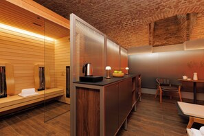 A modern spa room with wooden paneling, a massage table, a reception desk, and a seating area. - HiLight Suites Hotel (Vienna)