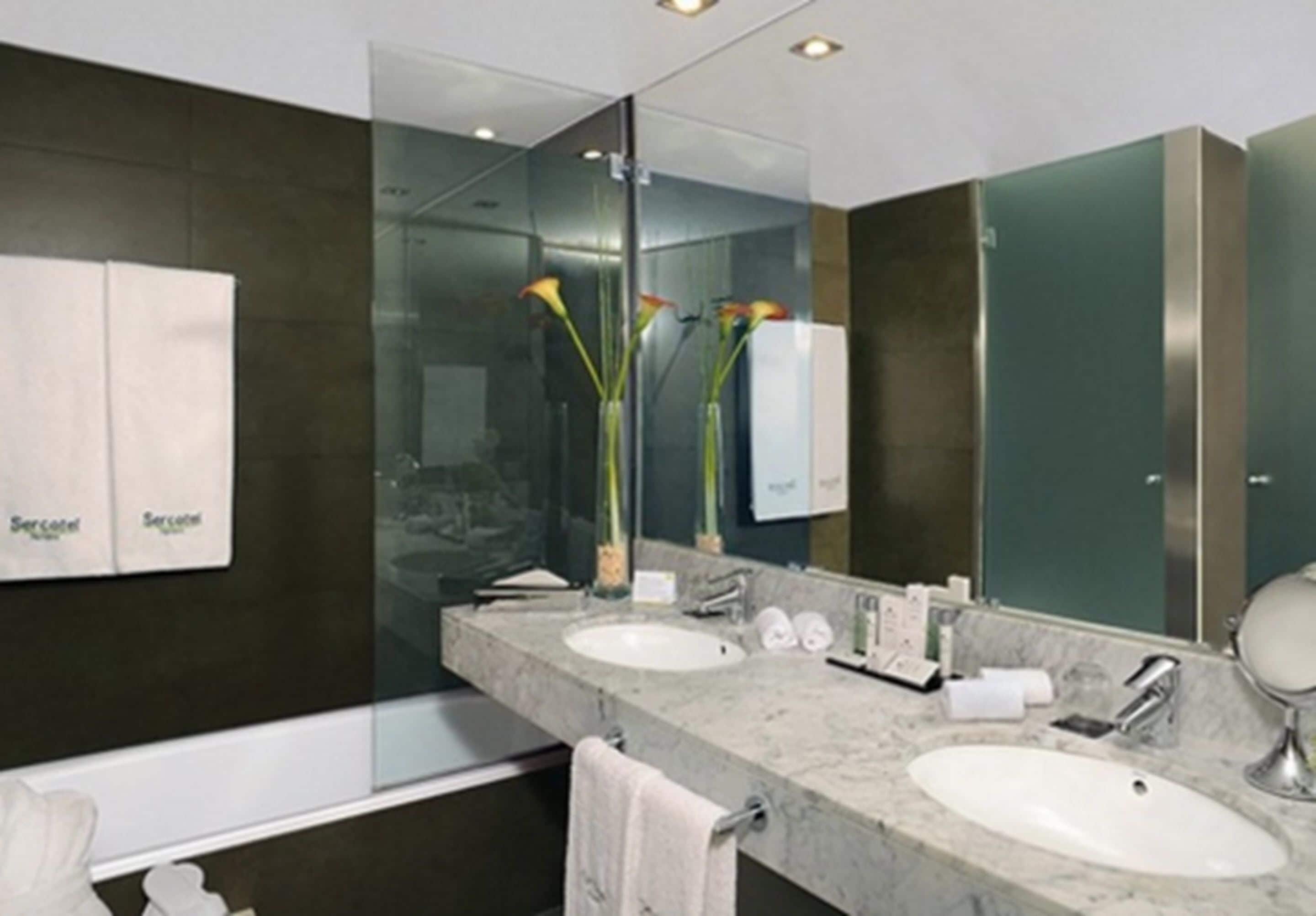 designer toiletries, hair dryer, bidet, towels