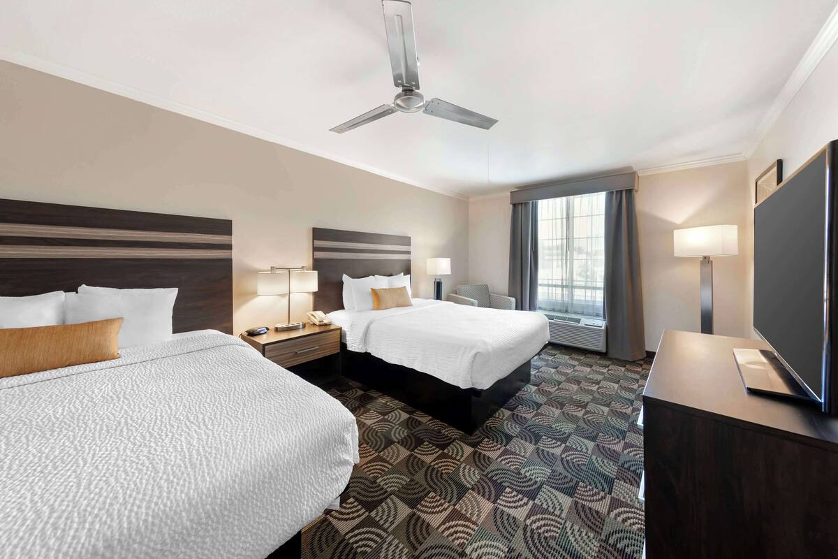 family suite, 2 queen beds, non smoking (living room;with sofabed) | minibar, in-room safe, iron/ironing board, free cots/infant beds