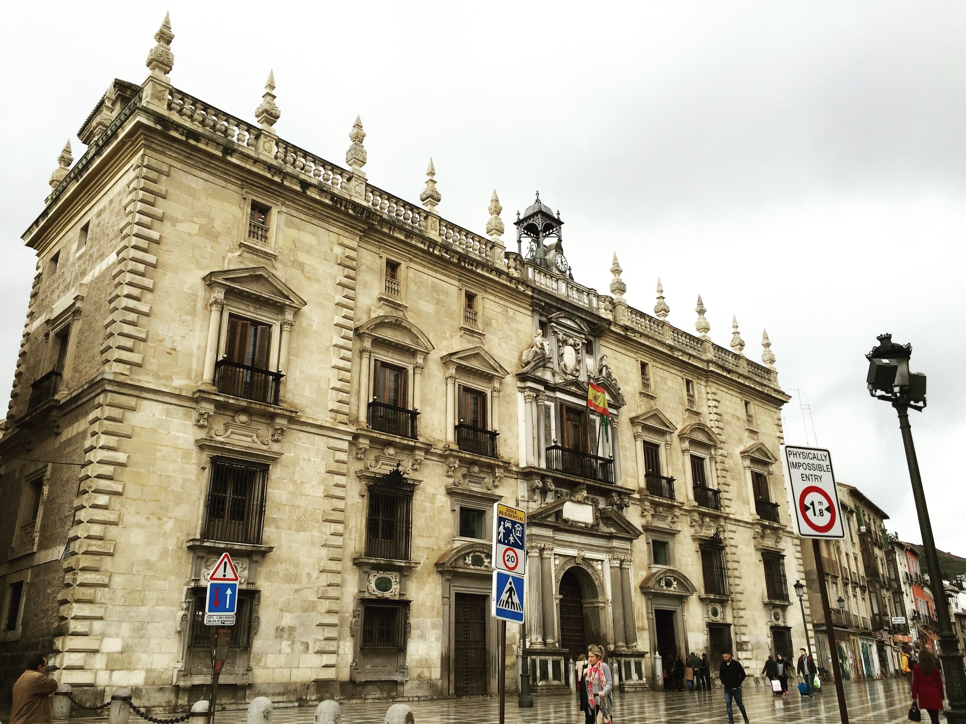 A historic building with classical architecture, featuring ornate balconies and a prominent entrance.