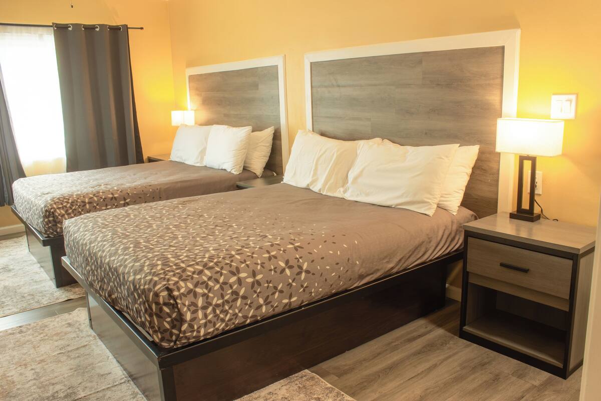 Double Queen Bedroom with Fireplace: Partial Ocean View | Premium bedding, desk, iron/ironing board, WiFi (free)