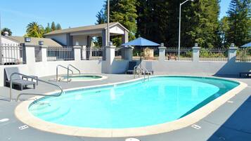 Outdoor pool, open 9:00 AM to 9 PM, pool umbrellas, pool loungers