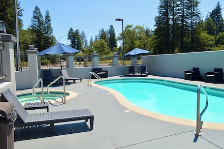 Outdoor pool, open 9:00 AM to 9 PM, pool umbrellas, sun loungers