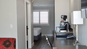 Suite, 1 King Bed, Non Smoking | Desk, laptop workspace, iron/ironing board, free WiFi