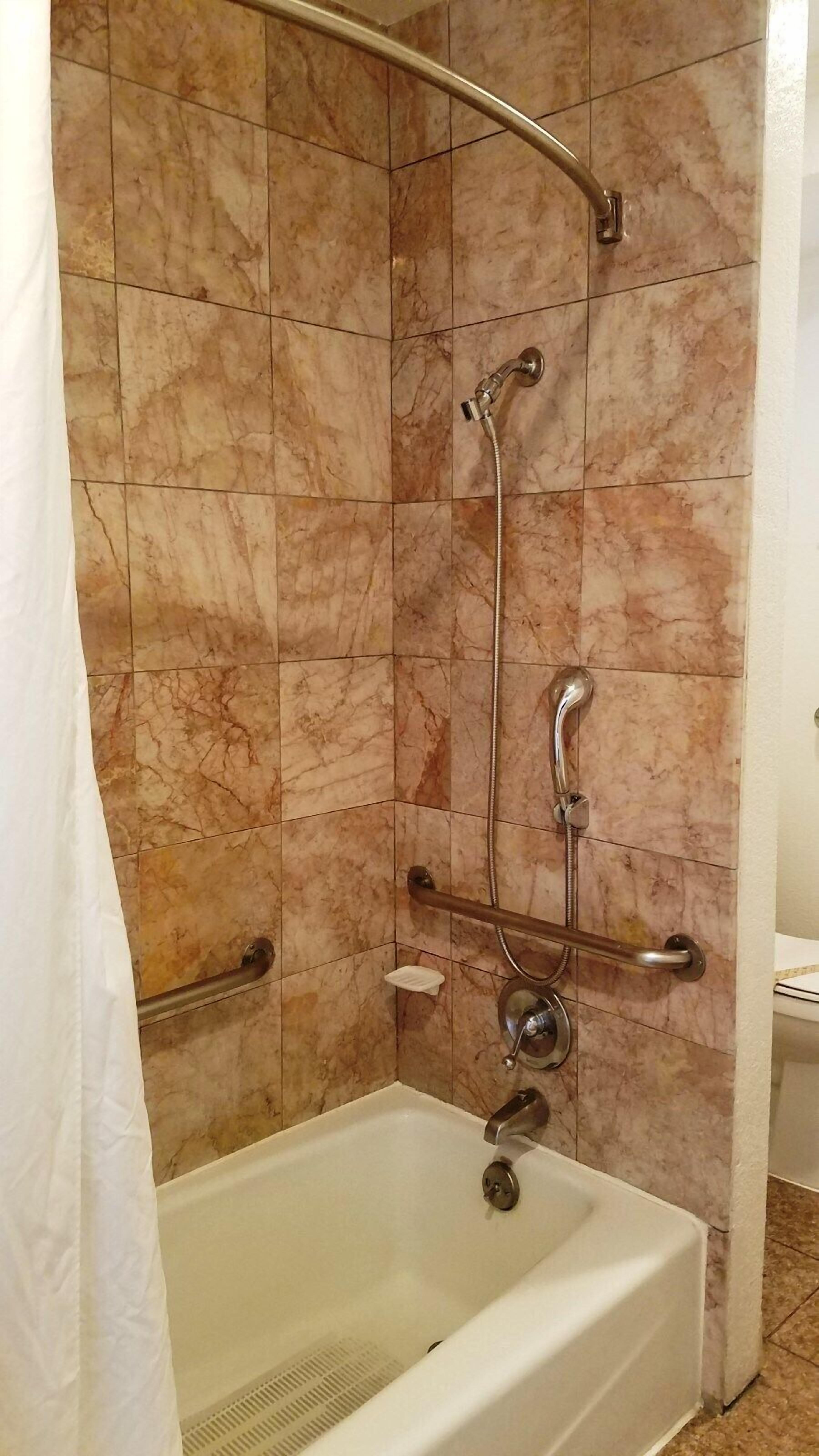 combined shower/bathtub, free toiletries, hair dryer, towels
