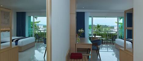 A modern hotel room with a balcony, a bed, a desk, and a chair.