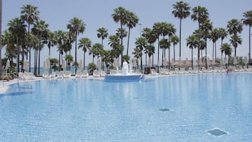 Indoor pool, outdoor pool, pool umbrellas, sun loungers