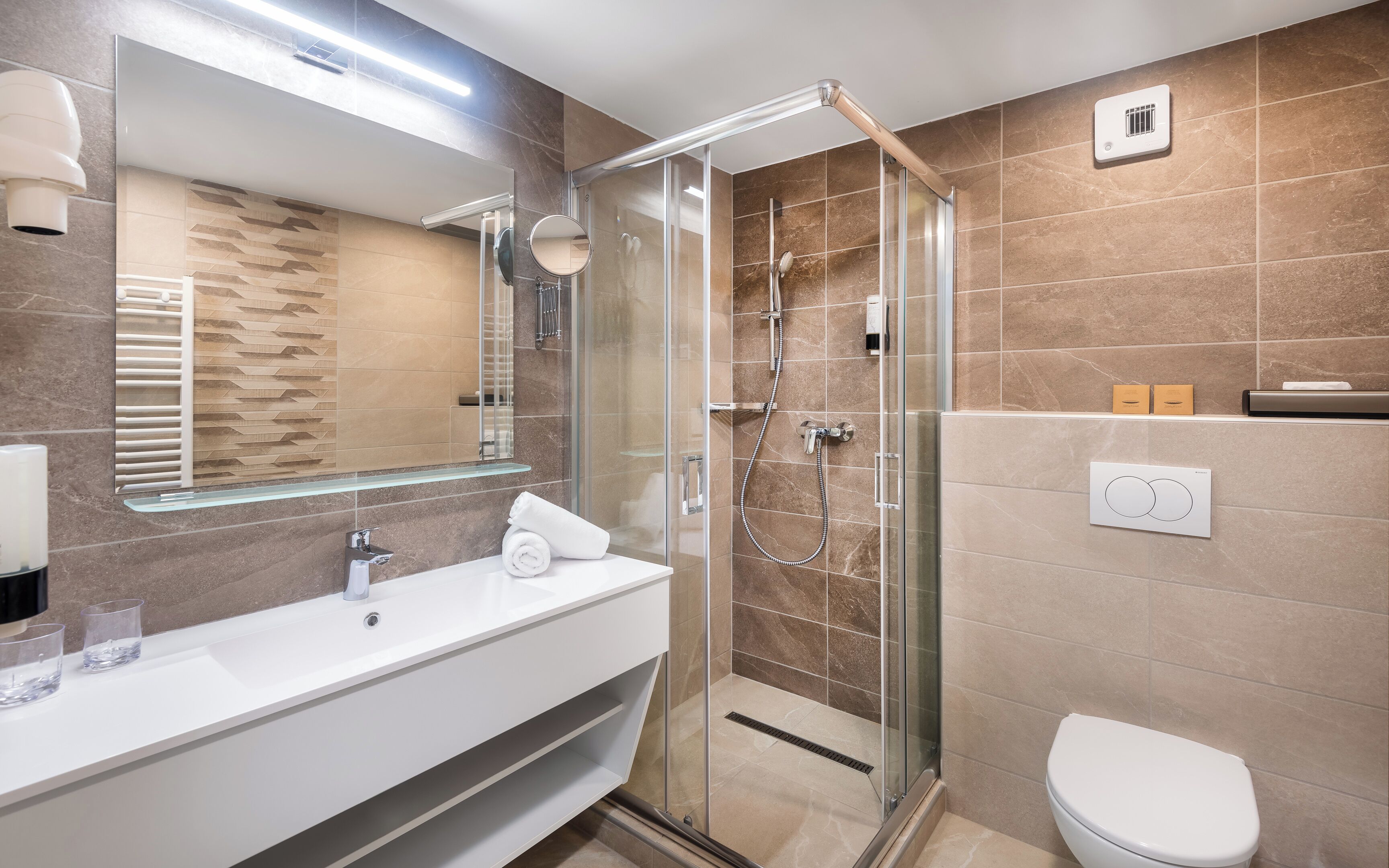 superior double room | bathroom | shower, hair dryer, towels