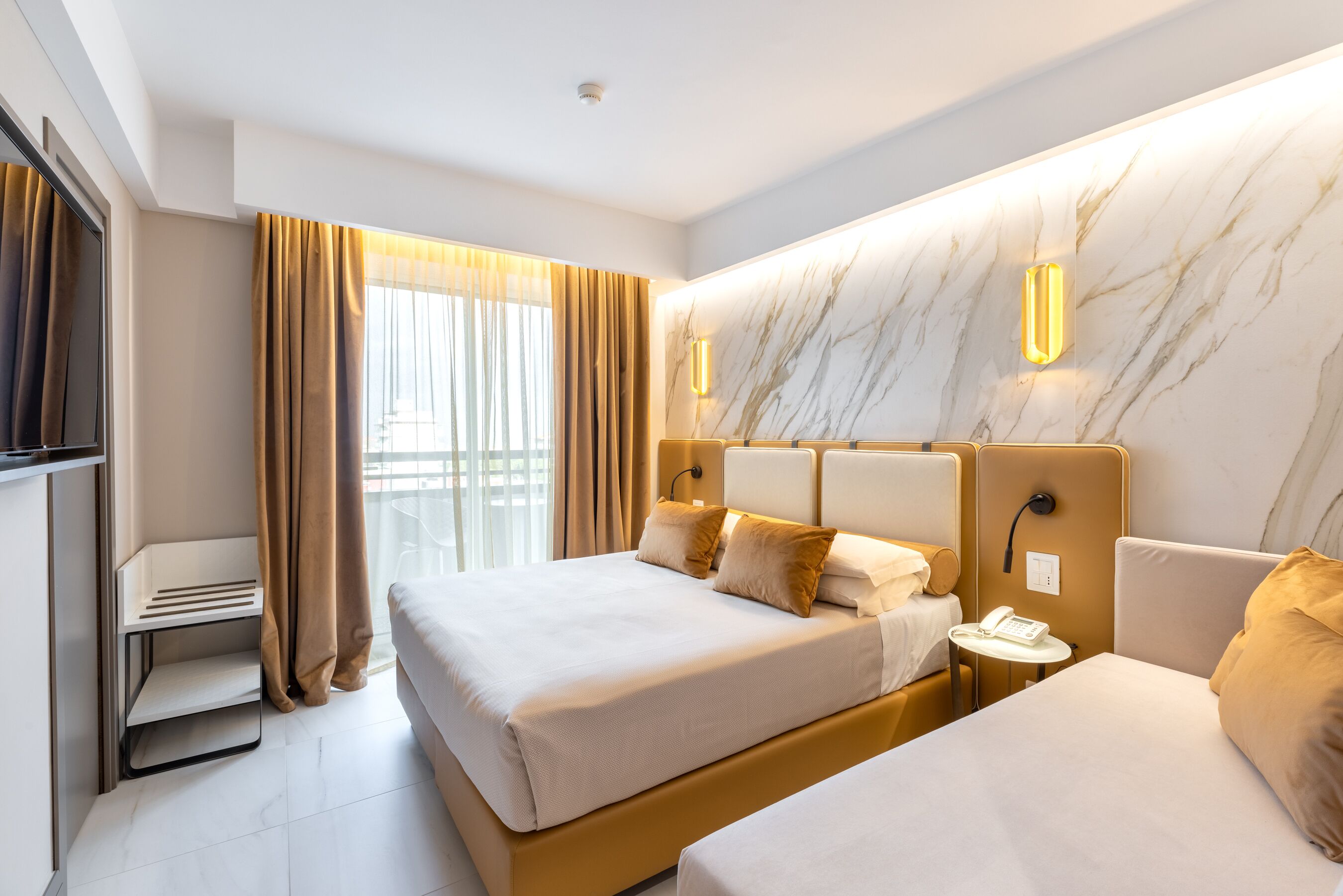 deluxe triple room | minibar, in-room safe, desk, blackout curtains