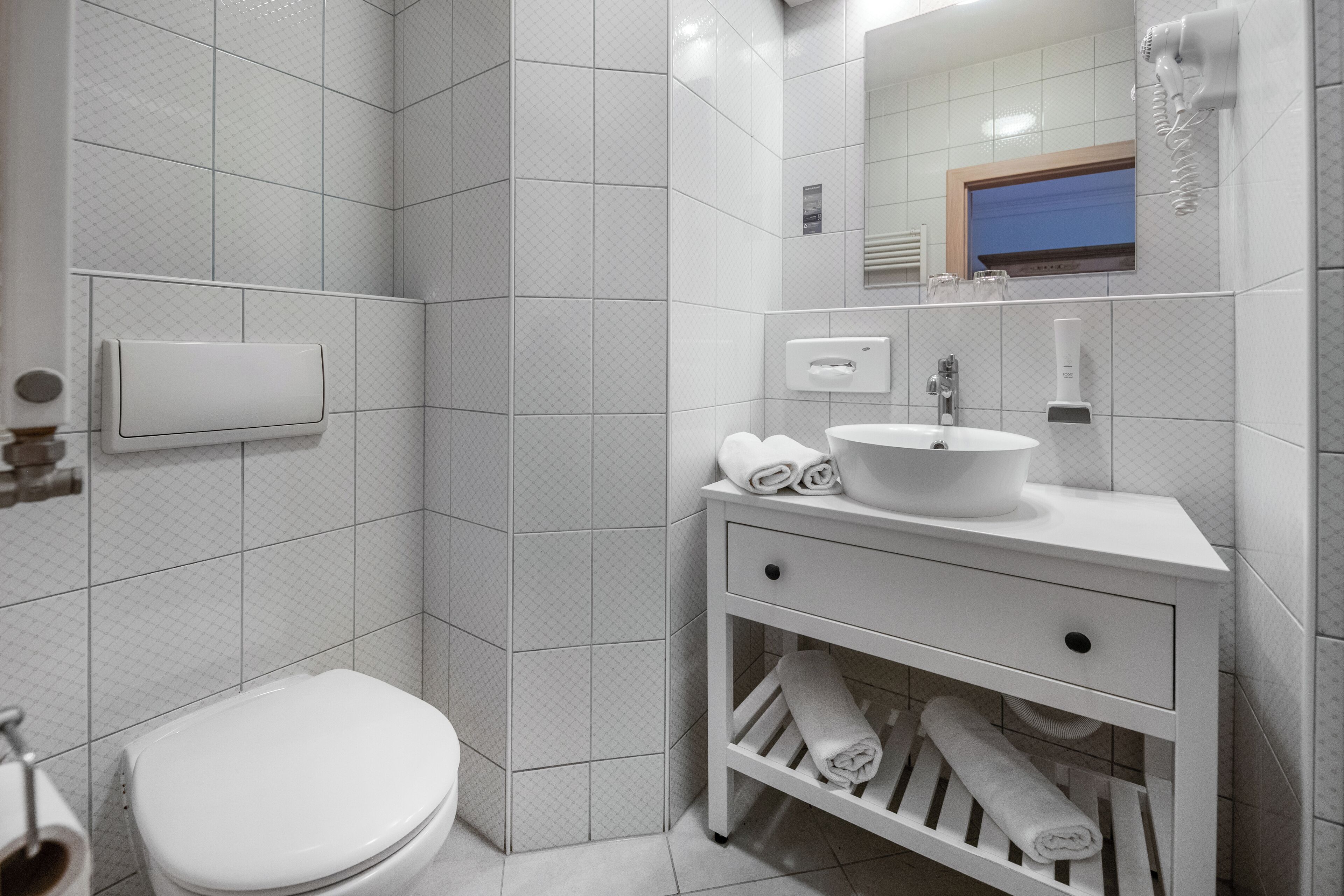 romantic double room | bathroom | hair dryer, towels, soap, toilet paper