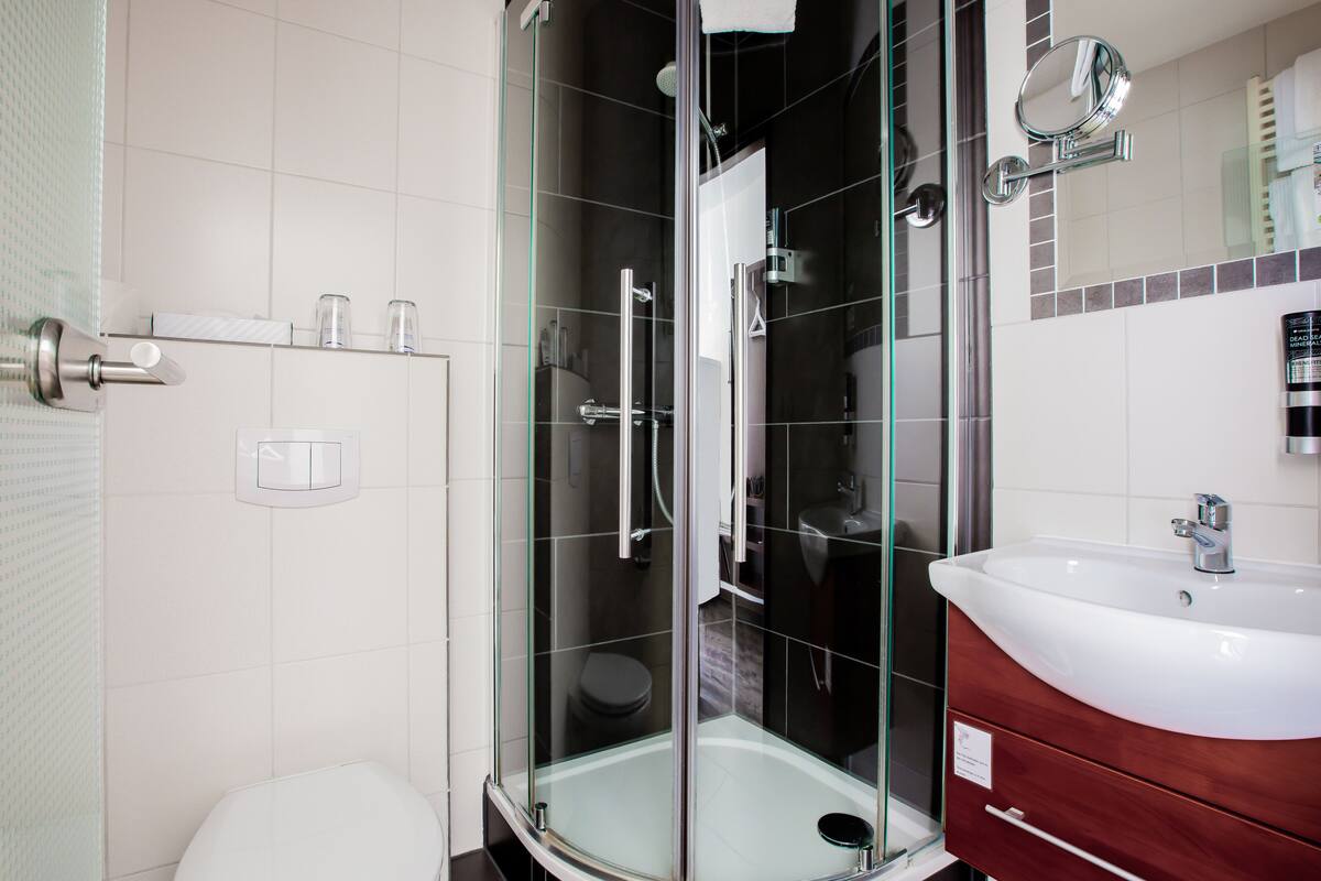 shower, eco-friendly toiletries, hair dryer, towels