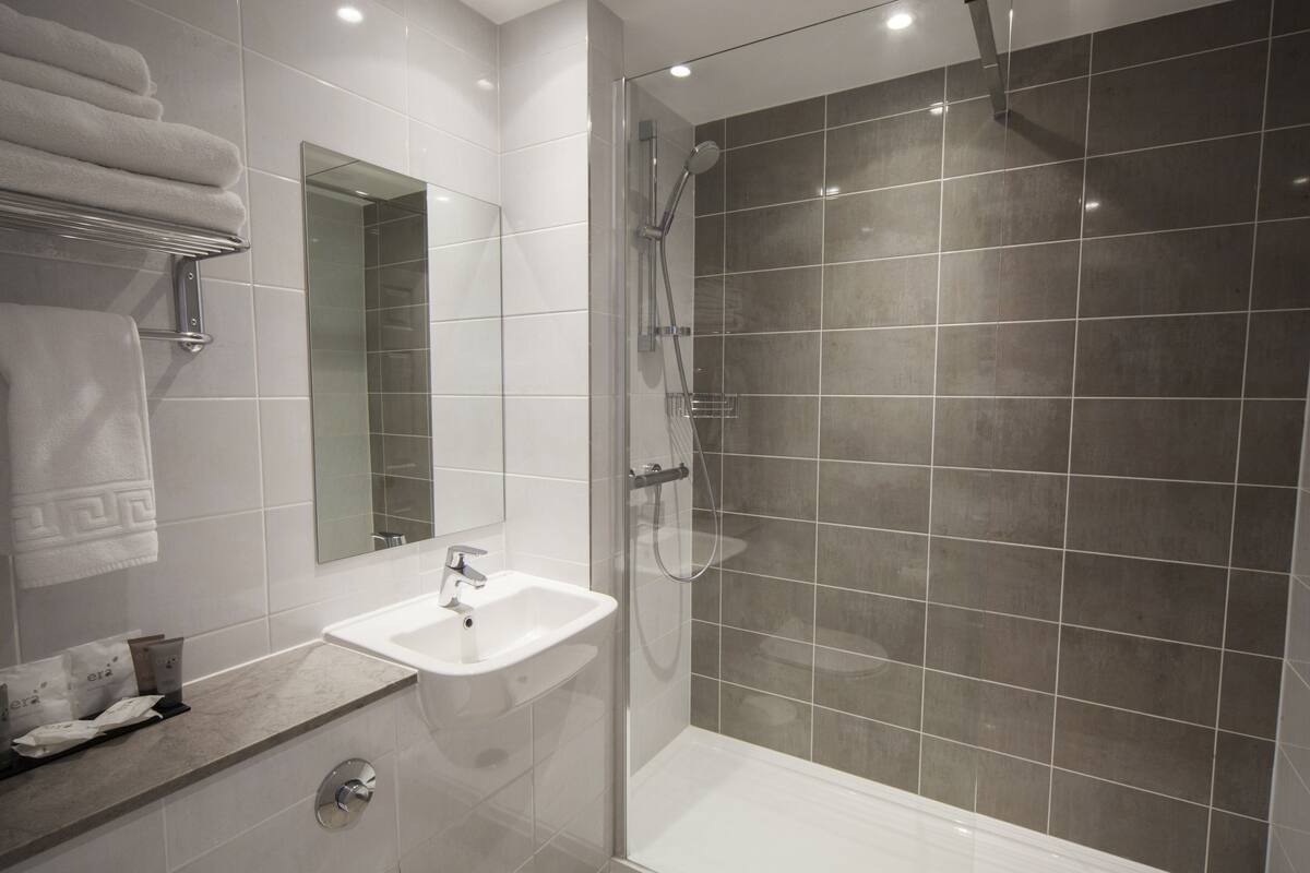 family room / quad room | bathroom | combined shower/bathtub, hair dryer, towels