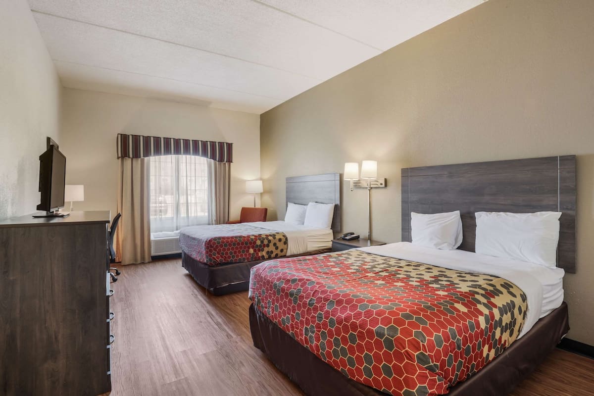 Desk, iron/ironing board, bed sheets