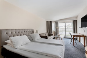 Hypo-allergenic bedding, pillowtop beds, desk, blackout drapes