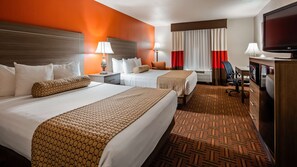 A hotel room with two beds, a television, a desk, and a chair. - Best Western Plus Memorial Inn & Suites (Oklahoma City)
