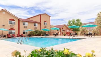 Seasonal outdoor pool, a heated pool, pool umbrellas, sun loungers