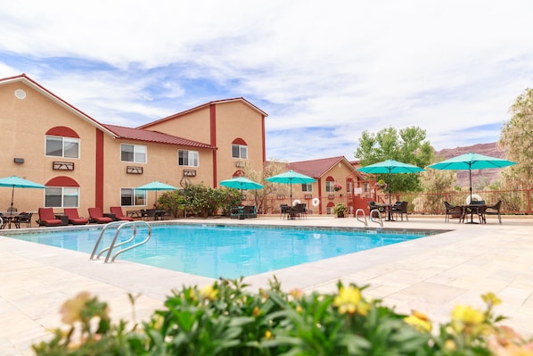 Seasonal outdoor pool, a heated pool, pool umbrellas, sun loungers