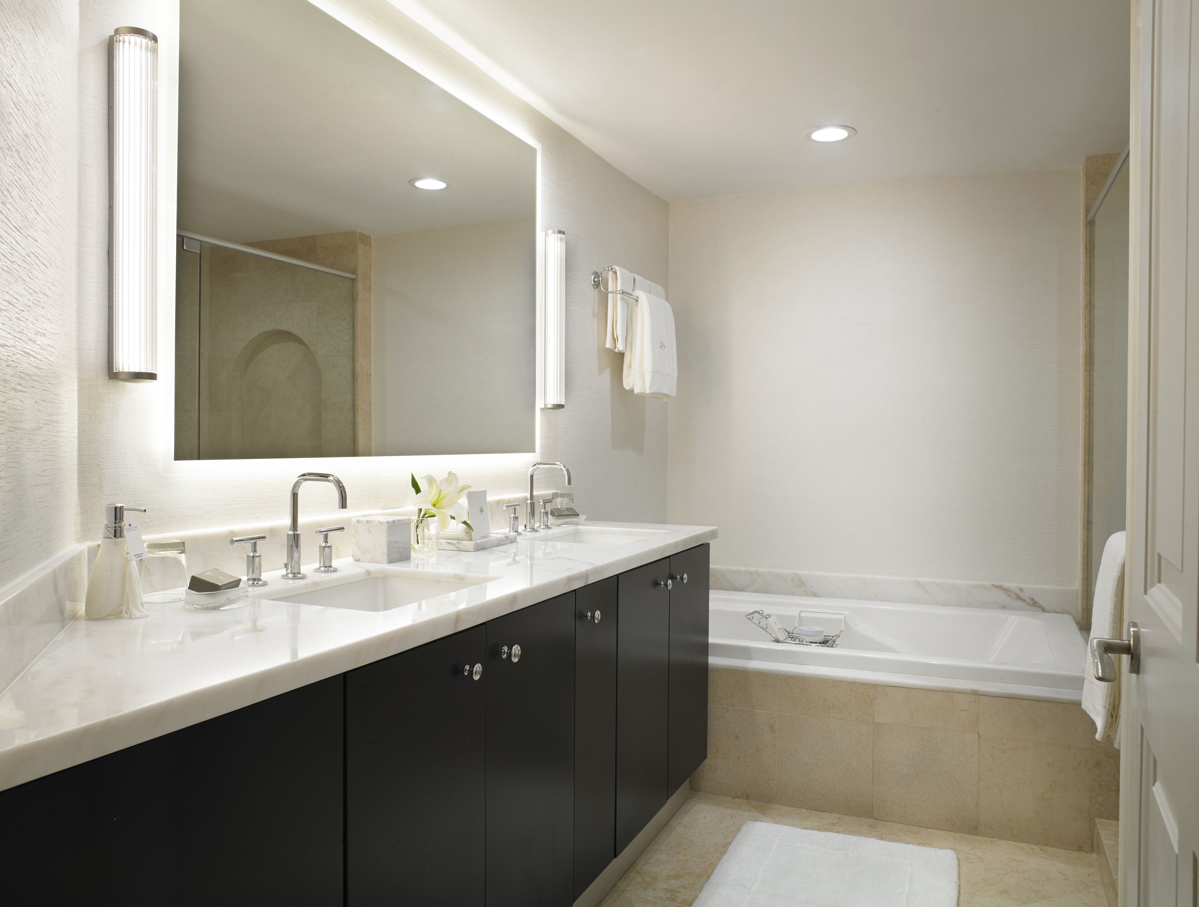 separate bathtub and shower, rainfall showerhead, designer toiletries