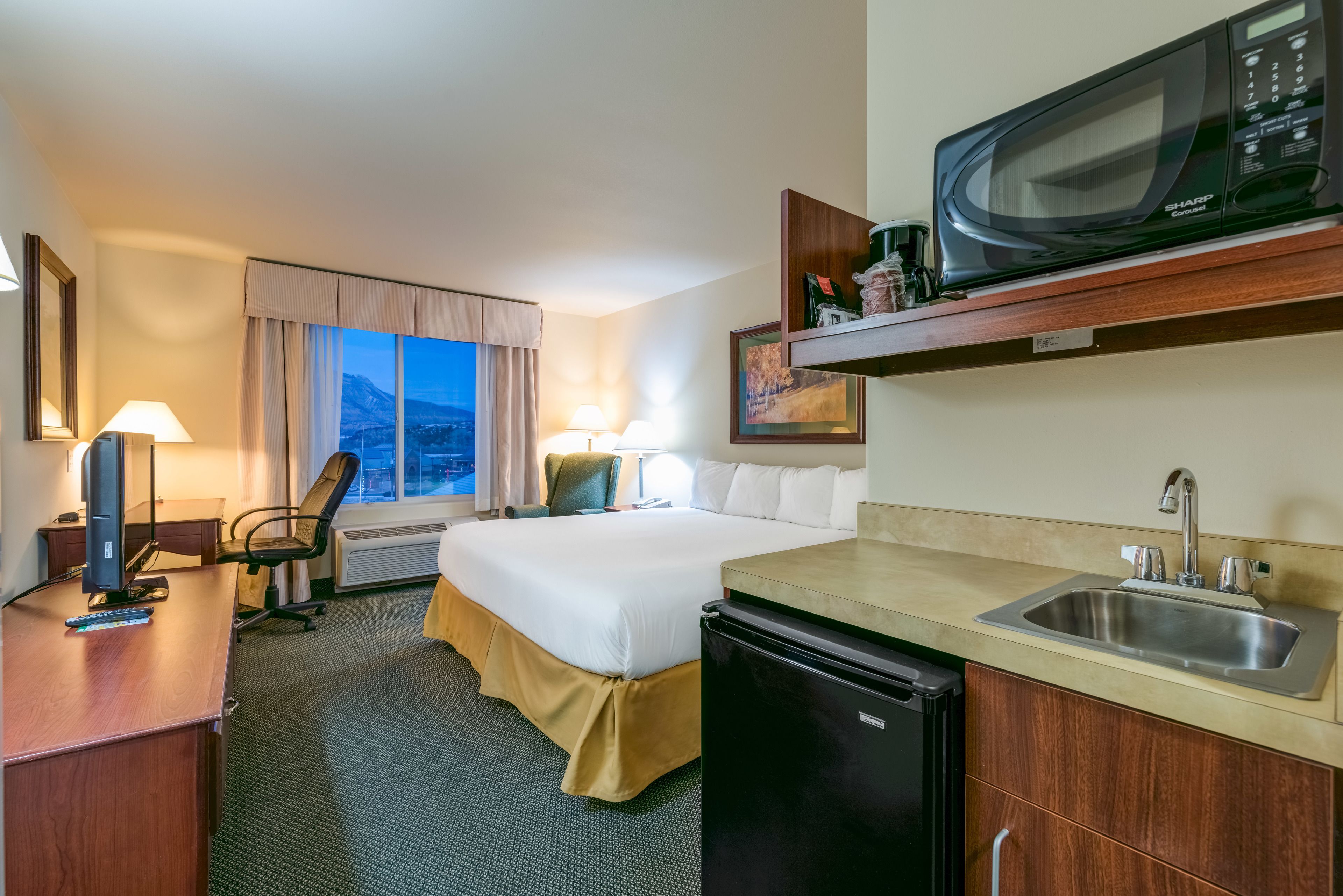 suite, 1 king bed with sofa bed, non smoking | in-room safe, desk, laptop workspace, iron/ironing board