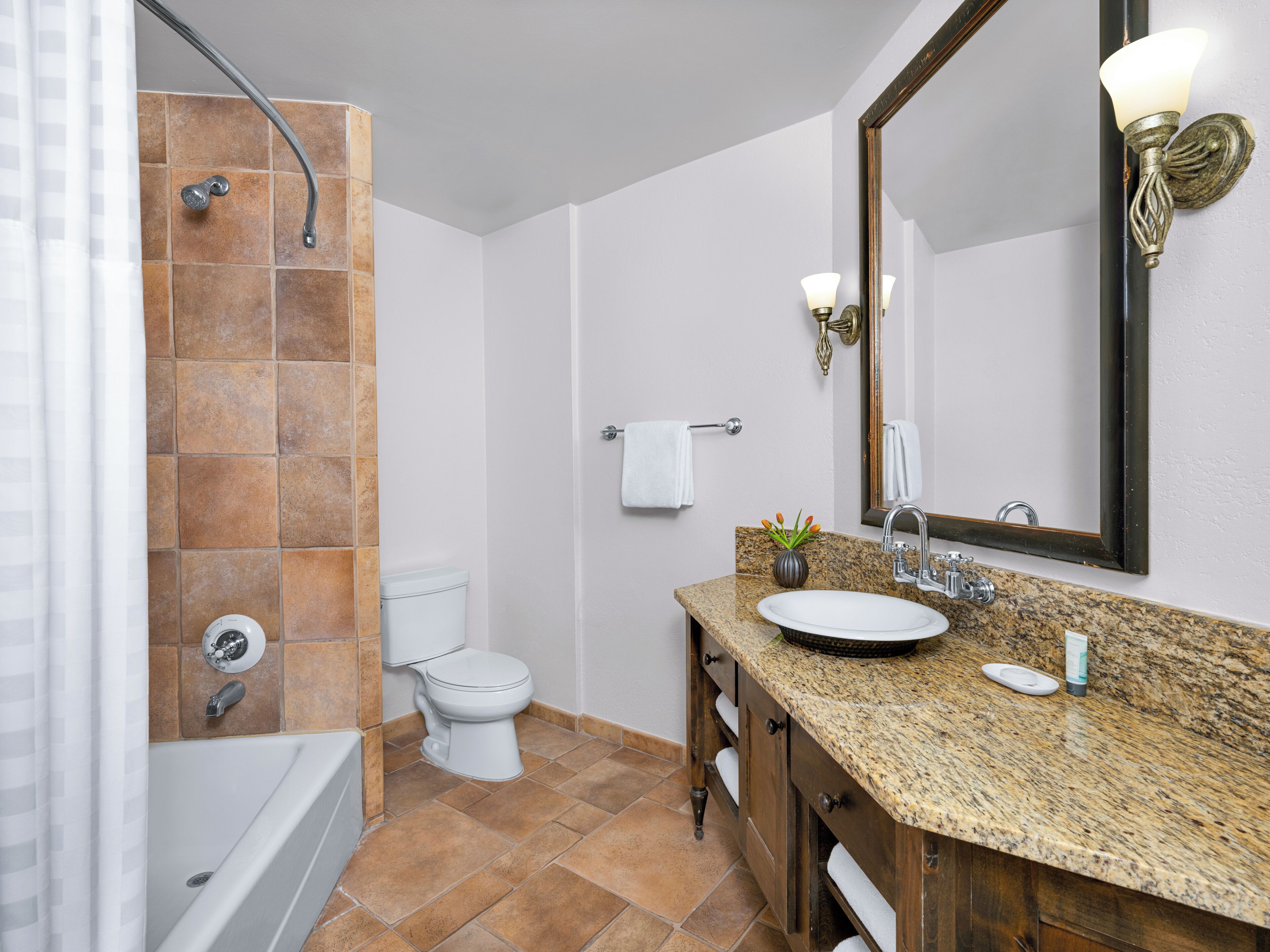 designer toiletries, hair dryer, towels, soap