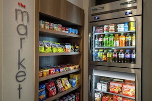 A grocery store with shelves stocked with snacks, beverages, and refrigerated items. - Residence Inn by Marriott Washington, DC National Mall (Washington)