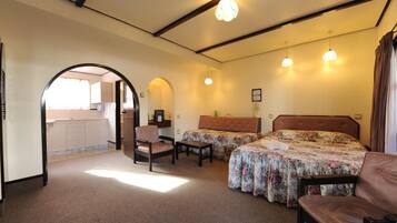 Desk, laptop workspace, blackout drapes, iron/ironing board