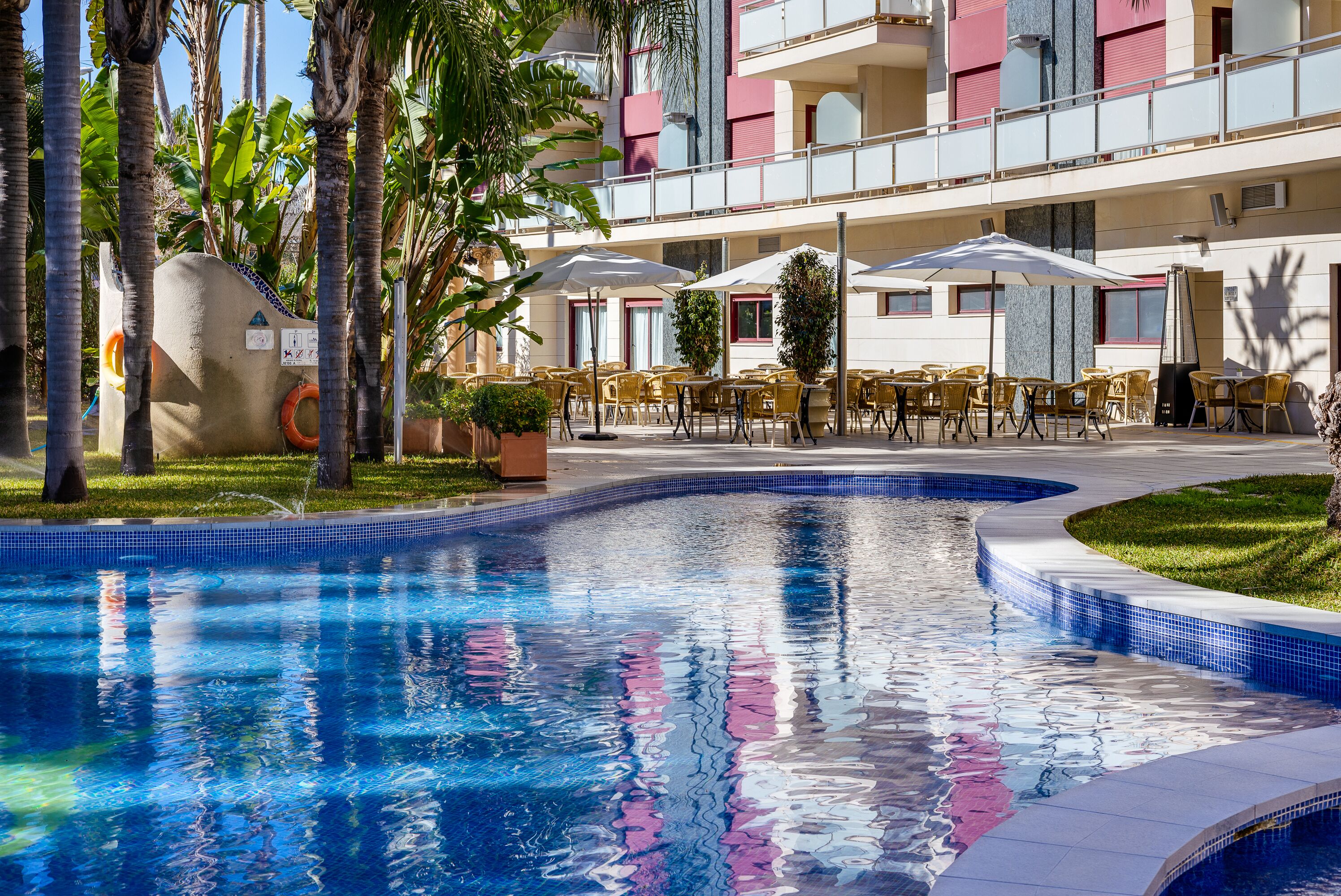 Outdoor pool, open 9:30 AM to 8:00 PM, pool umbrellas, sun loungers