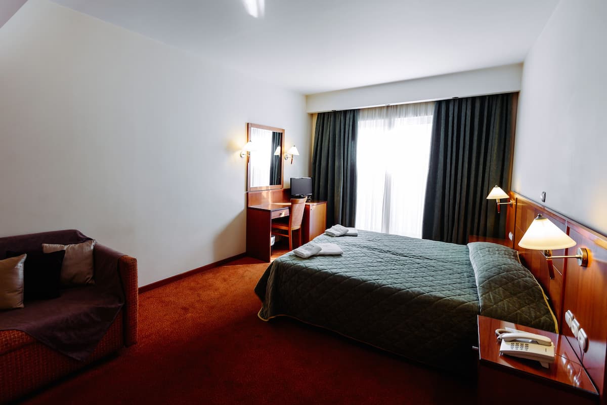 Double or Twin Room | Minibar, in-room safe, desk, iron/ironing board