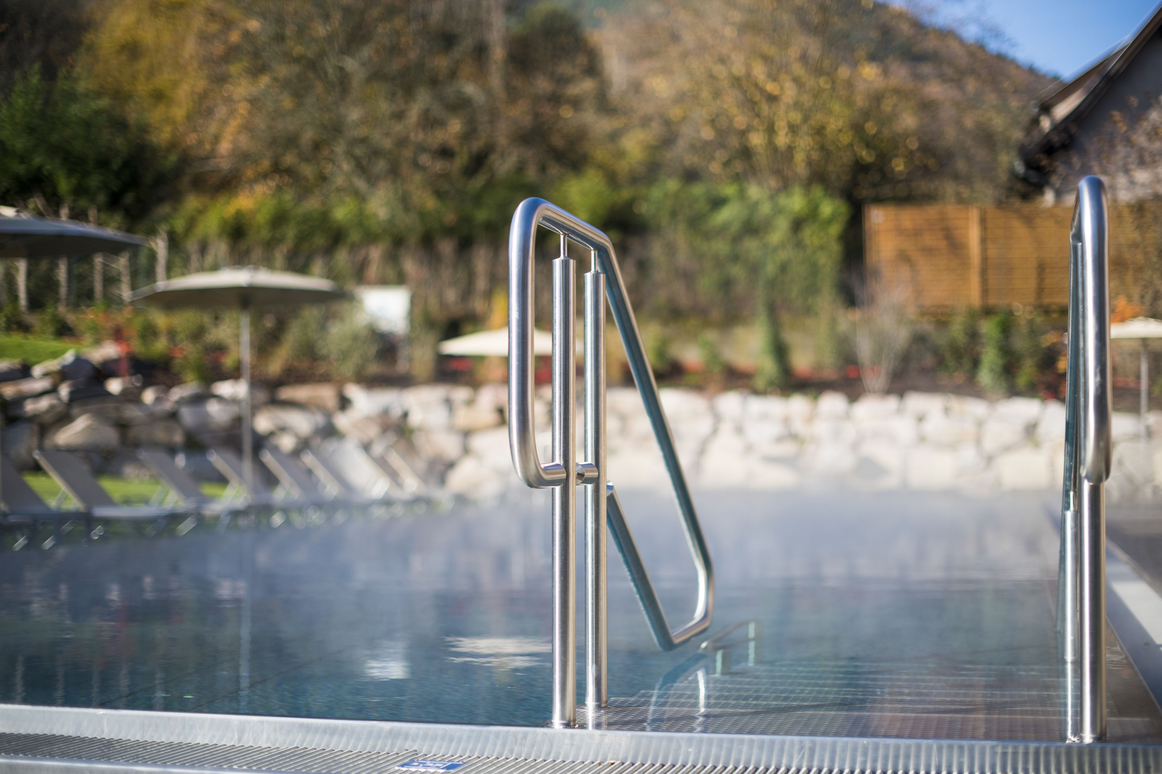 2 indoor pools, 2 outdoor pools, open 7 am to 7:30 pm, pool umbrellas