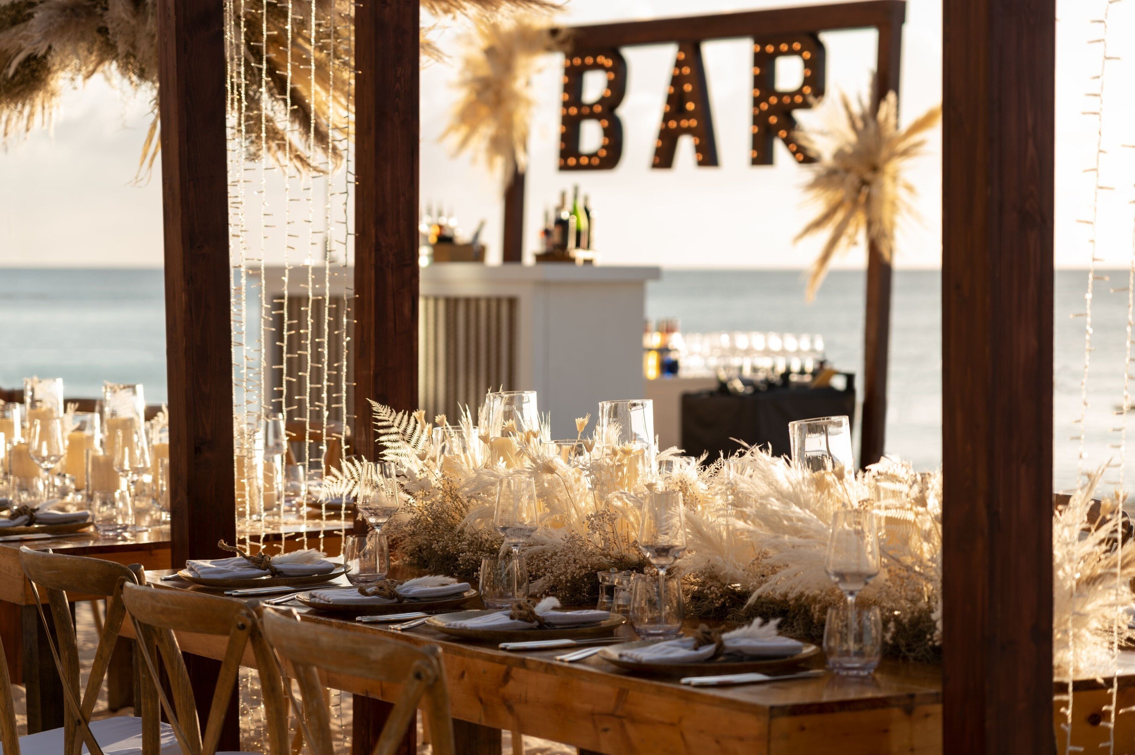 on the beach, white sand, beach cabanas, sun-loungers