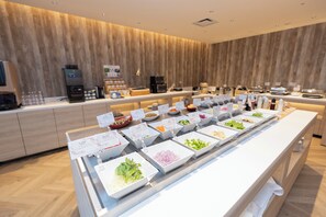 A buffet with various food items and a coffee station. - Hiyori Hotel Osaka Suminoekoen Station (Osaka)