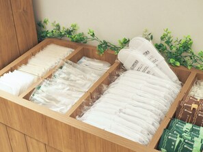A wooden drawer with compartments containing white toothbrushes and toothpaste tubes. - Hiyori Hotel Osaka Suminoekoen Station (Osaka)