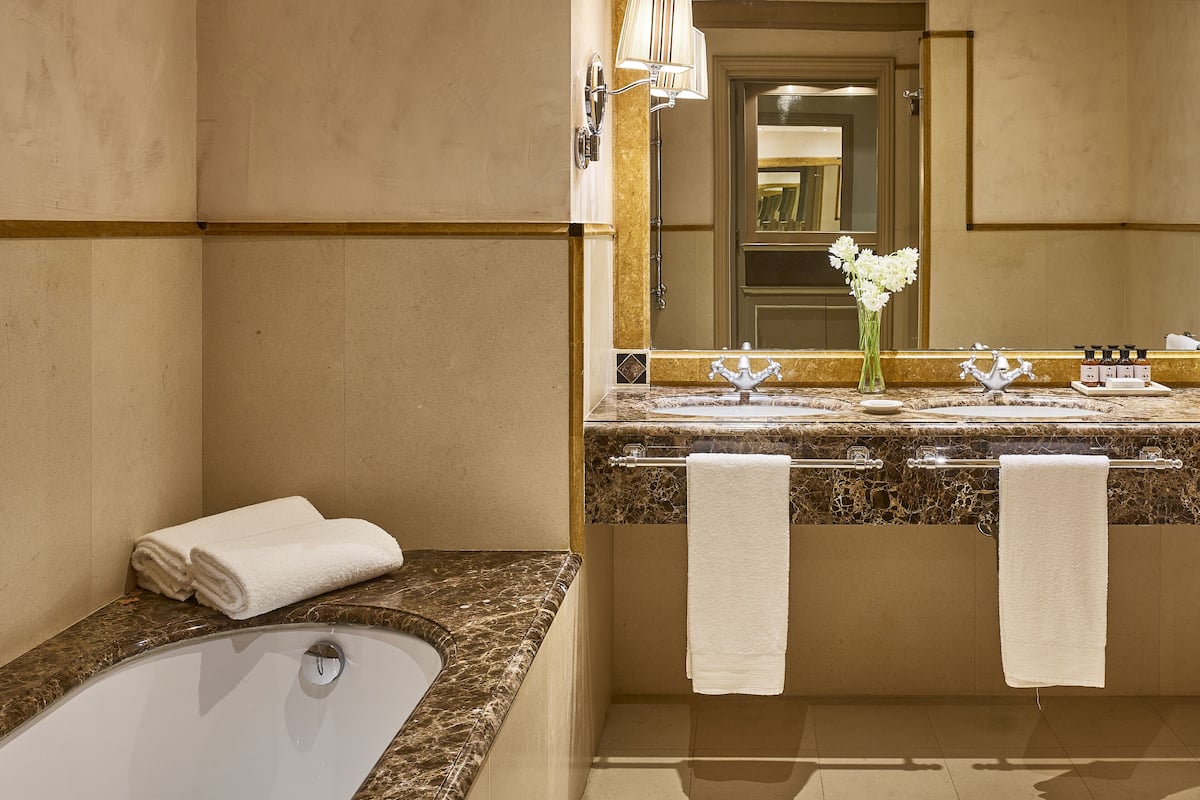 suite | bathroom | separate bathtub and shower, free toiletries, hair dryer, bathrobes