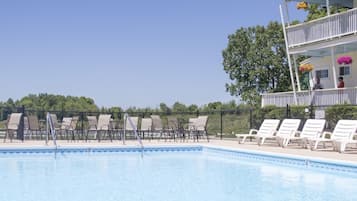 Outdoor pool, a heated pool, sun loungers