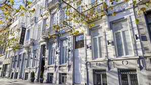 A historic building with a classic architectural style, featuring ornate balconies and large windows. - The Augustin (Brussels)